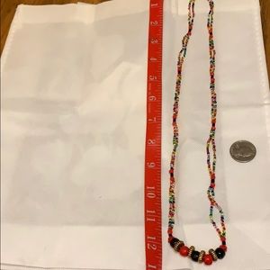 Pretty multi-colored beads 13” long.